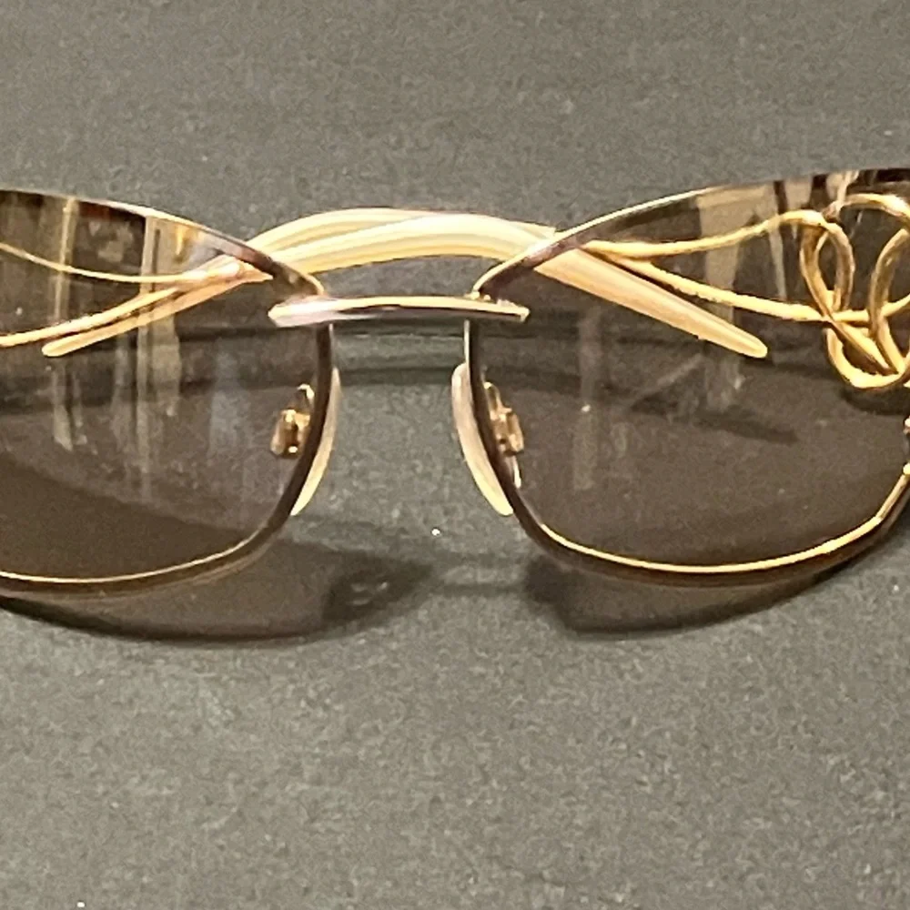 Roberto Cavalli Gold Rimless Sunglasses with Gradient Brown Lenses
